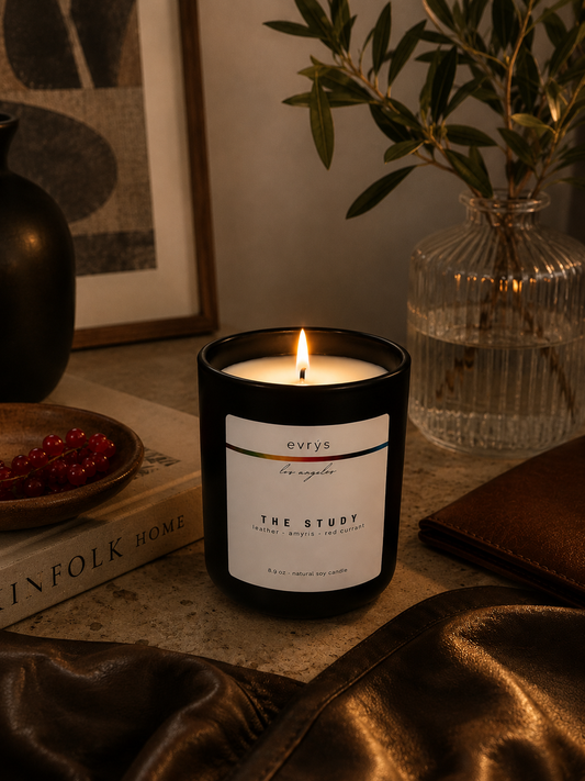 The Study candle on a surface with decorative items