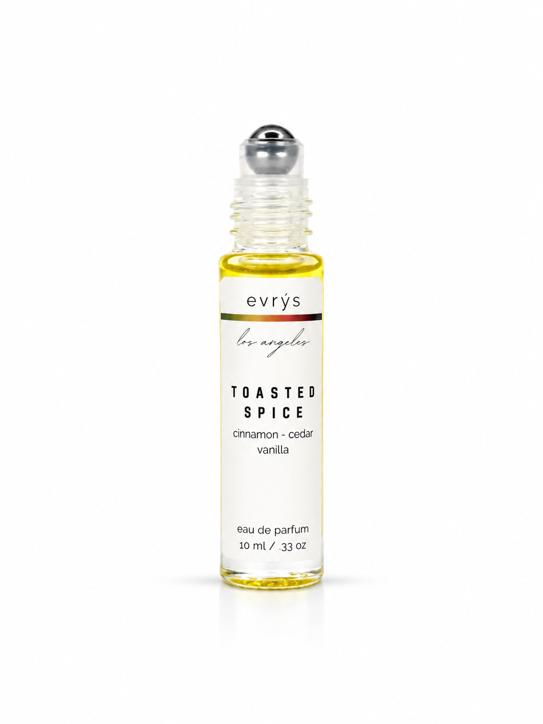 evrys Toasted Spice oil roller perfume bottle on a white background