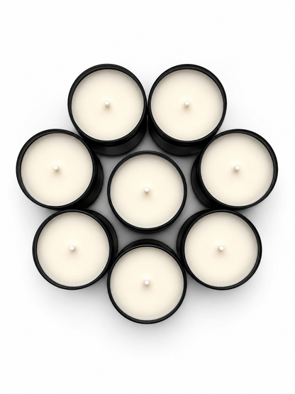 Eight white candles in black holders arranged in a circle on a white background