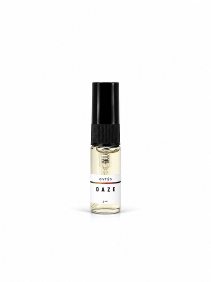 Small perfume bottle labeled 'evrys' Daze on a white background