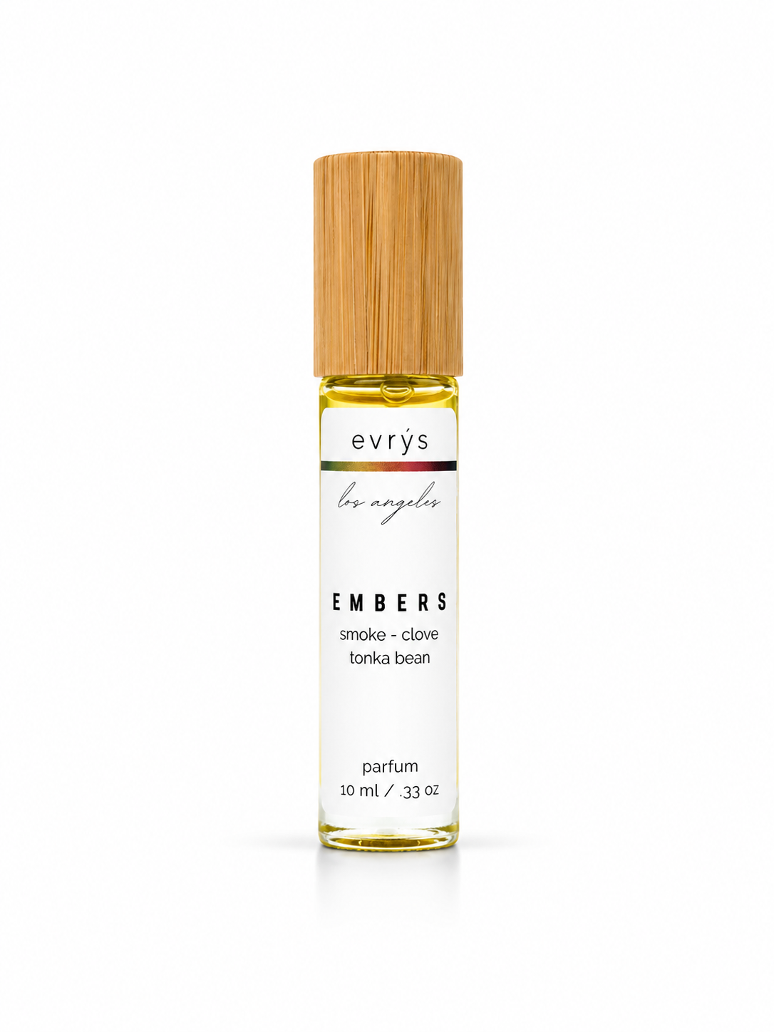 evrys Embers oil roller parfum bottle with a bamboo cap on a white background