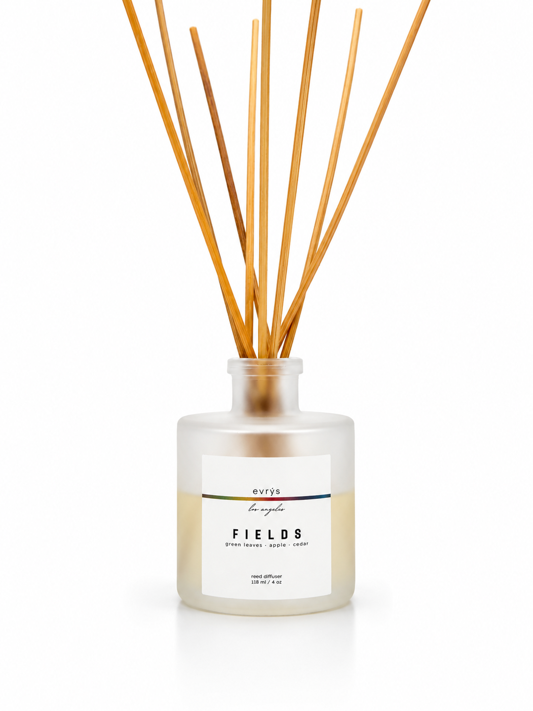 Fields reed diffuser with wooden reeds in a glass bottle on a white background