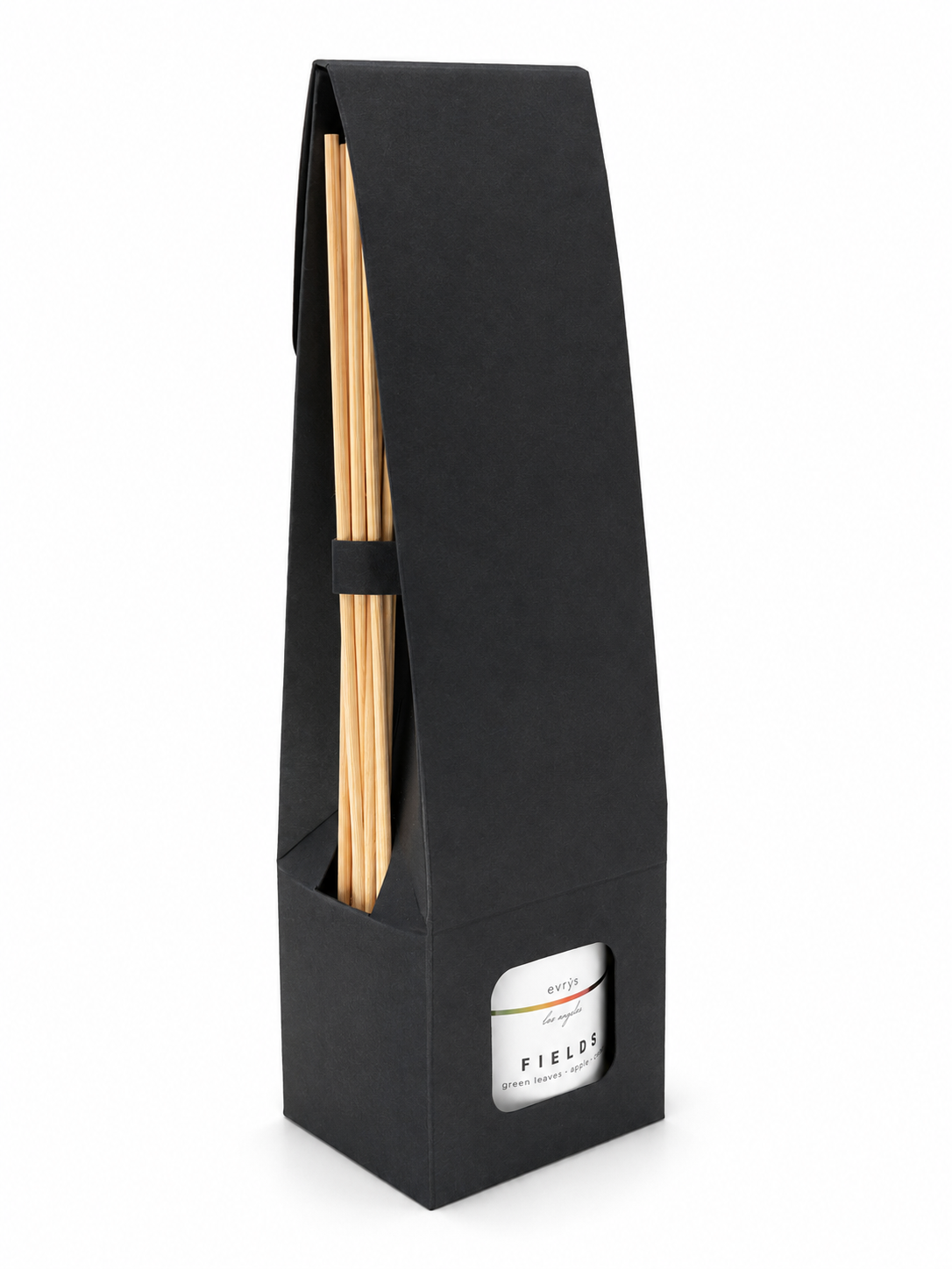 Black packaging with a container and wooden sticks on a white background