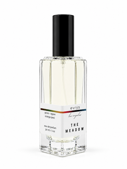 Perfume bottle labeled 'The Meadow' by evrys on a white background