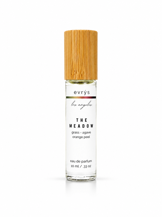 evrys oil roller perfume bottle The Meadow with a bamboo cap on a white background