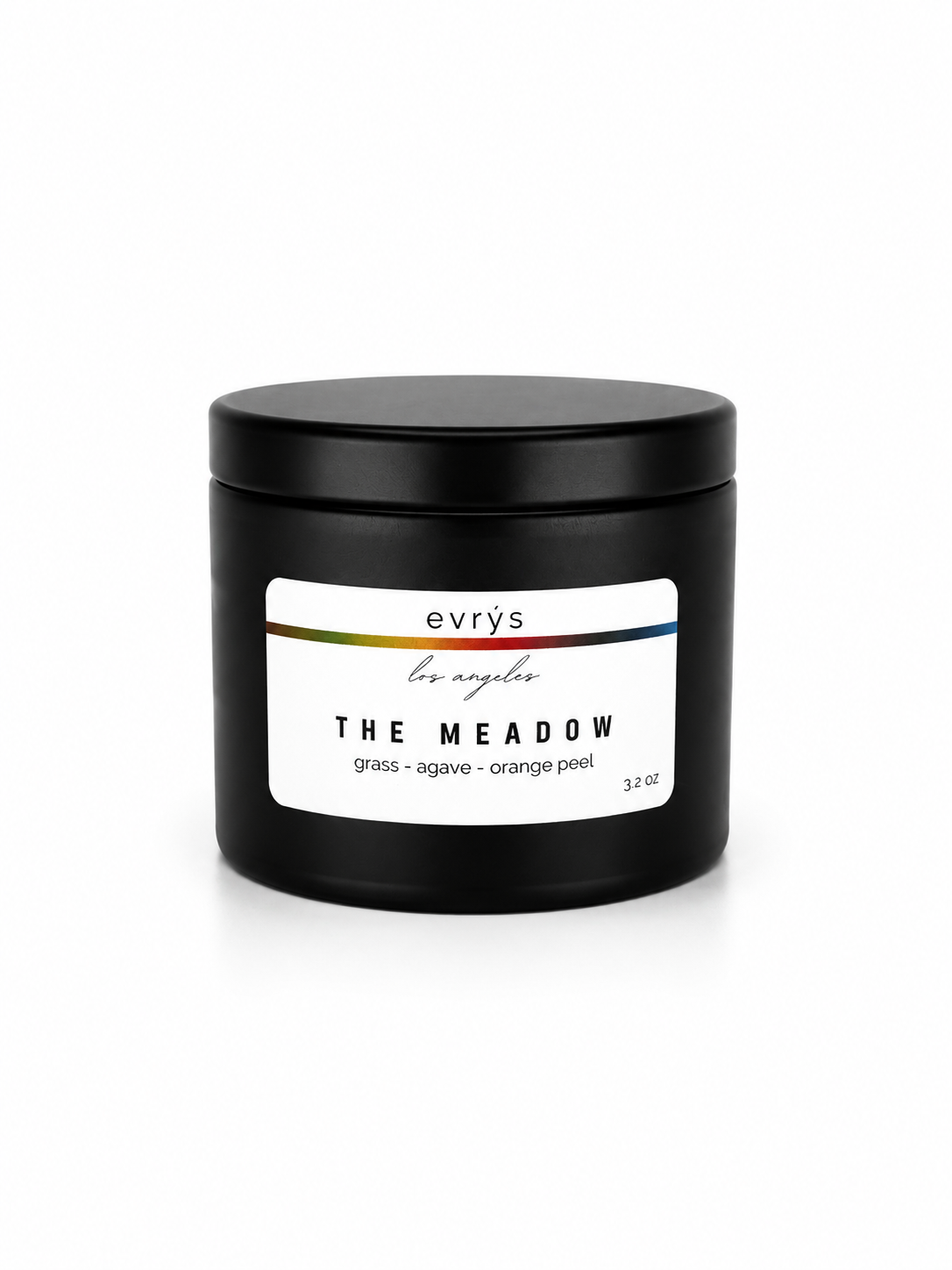Black container candle with an evrys The Meadow label on a white background