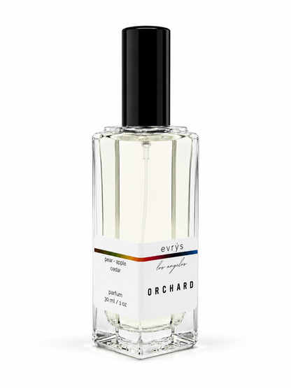 Perfume bottle labeled 'Orchard' by evrys on a white background