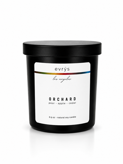 evrys candle labeled 'Orchard' on a white background