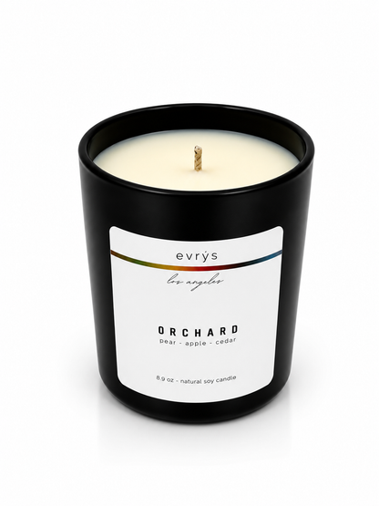 evrys candle labeled 'Orchard' on a white background