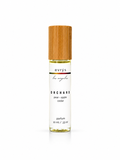 evrys Orchard oil roller perfume bottle on a white background
