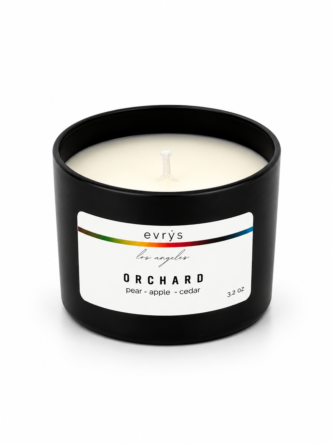 Evrys Orchard candle in a black container on a white background