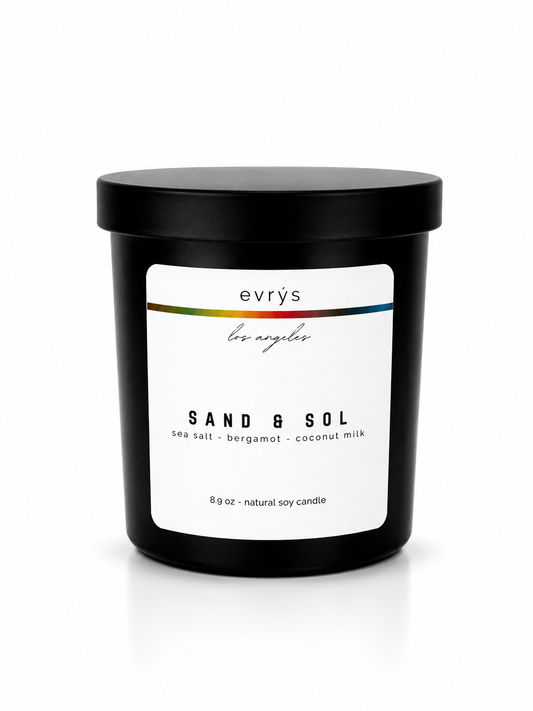 evrys candle labeled 'Sand & Sol' on a white background