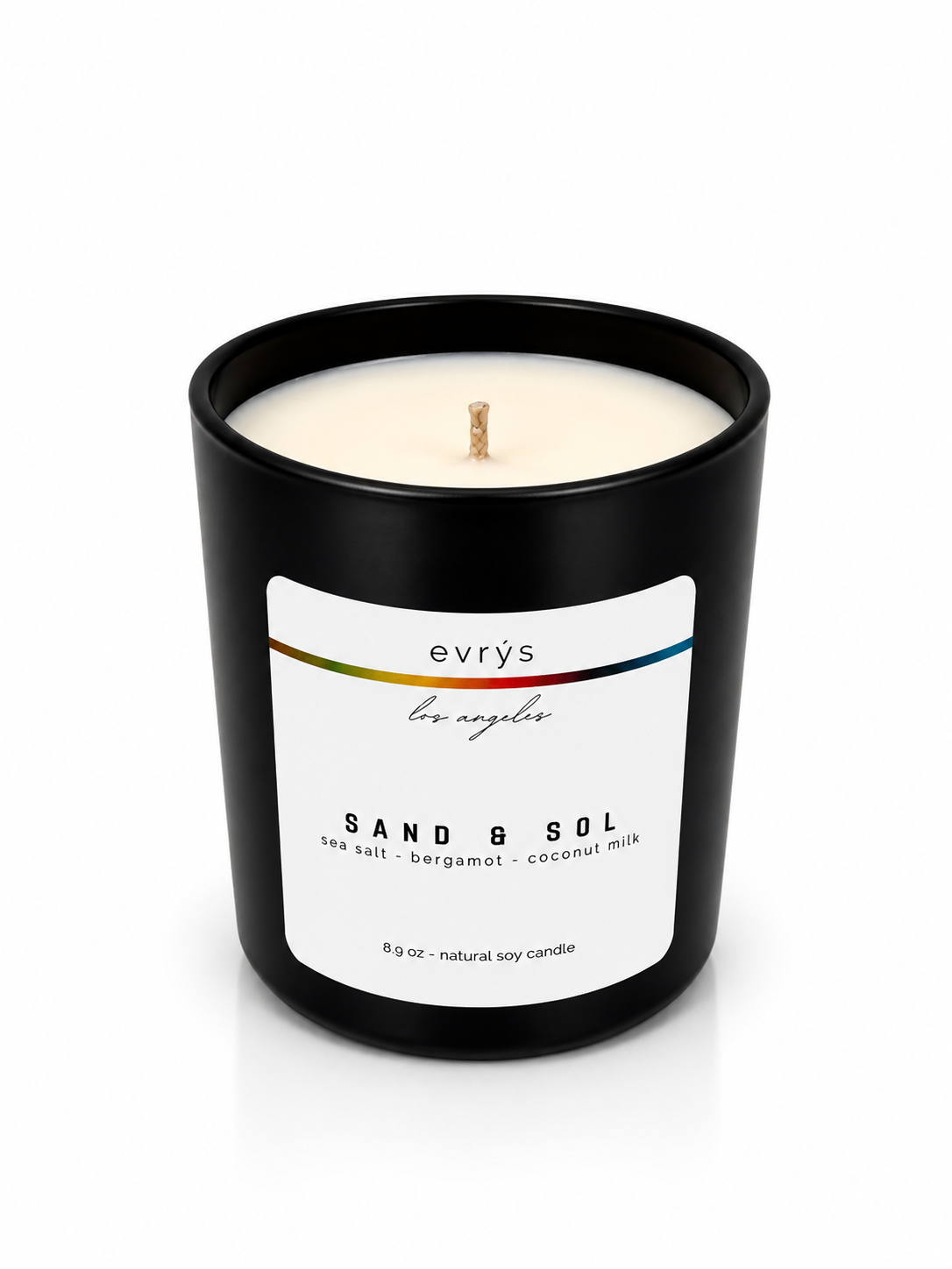 evrys candle labeled 'Sand & Sol' on a white background