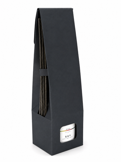 Black reed diffuser box with a label on a white background