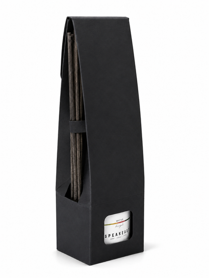 Black rectangular packaging with a cylindrical product inside on a white background