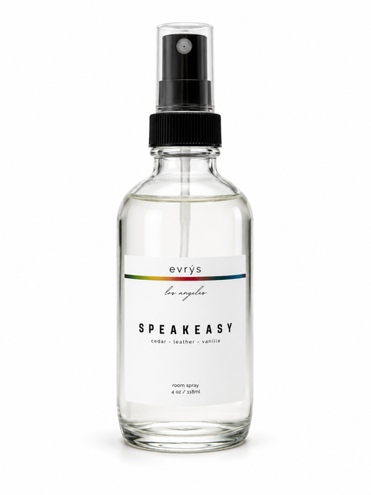 Glass room spray bottle labeled 'evrys Speakeasy' on a white background