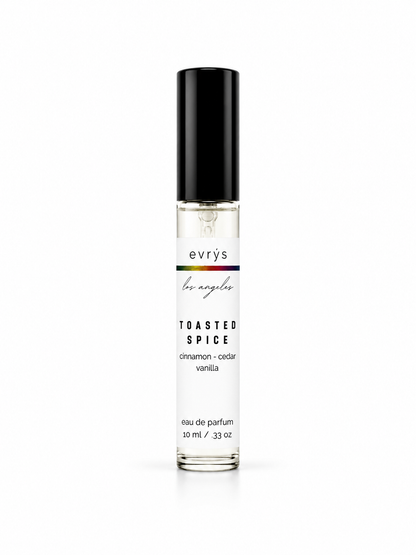 Perfume bottle with Toasted Spice label on a white background