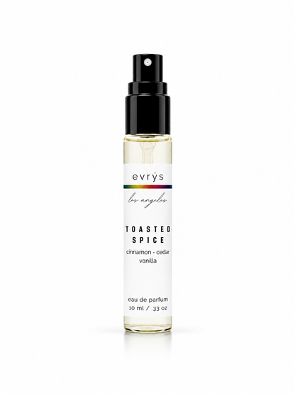 Perfume bottle with Toasted Spice label on a white background