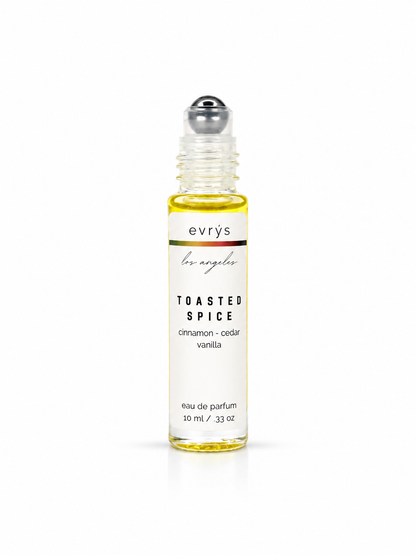 evrys Toasted Spice oil roller perfume bottle on a white background