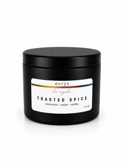 Black candle jar labeled 'Toasted Spice' by evrys on a white background