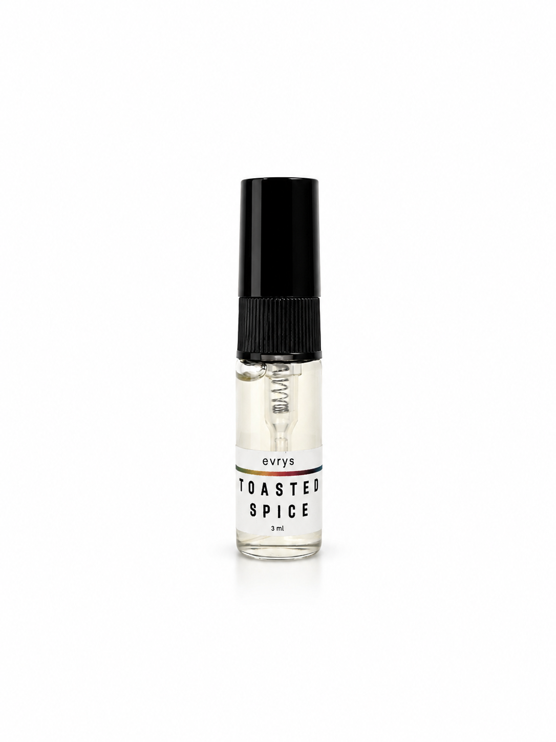 Small glass fragrance bottle labeled 'Toasted Spice' with a black cap on a white background